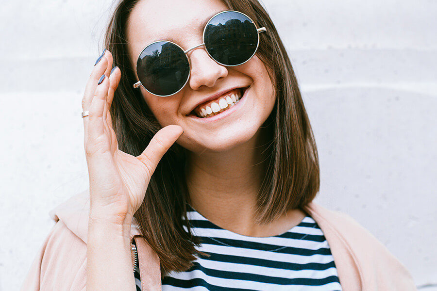 Woman smiling with sunglasses