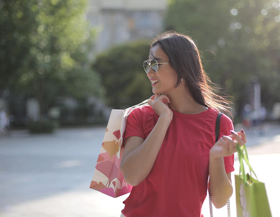 Woman smiling and shopping on South Lake Avenue